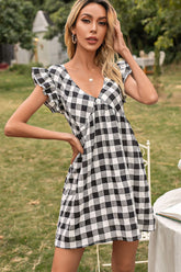 Robe à carreaux et manches papillon à décolleté en V